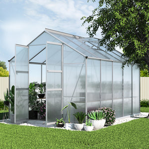 green greenhouse and aluminium shed